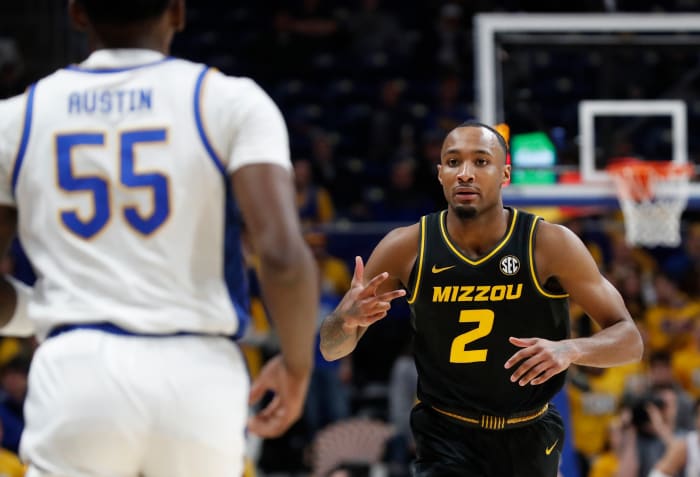 Nov 28, 2023; Pittsburgh, Pennsylvania, USA; Missouri Tigers guard Tamar Bates (2) reacts to Pittsburgh Panthers forward Zack Austin (55) after Bates made a three point basket during the first half at the Petersen Events Center